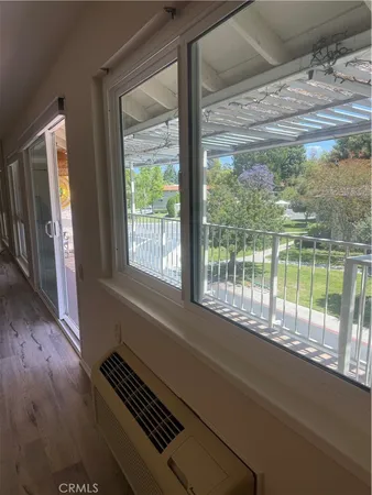 a bedroom with a bed and a night stand