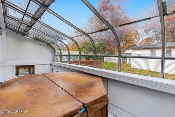 a view of a room with a large window