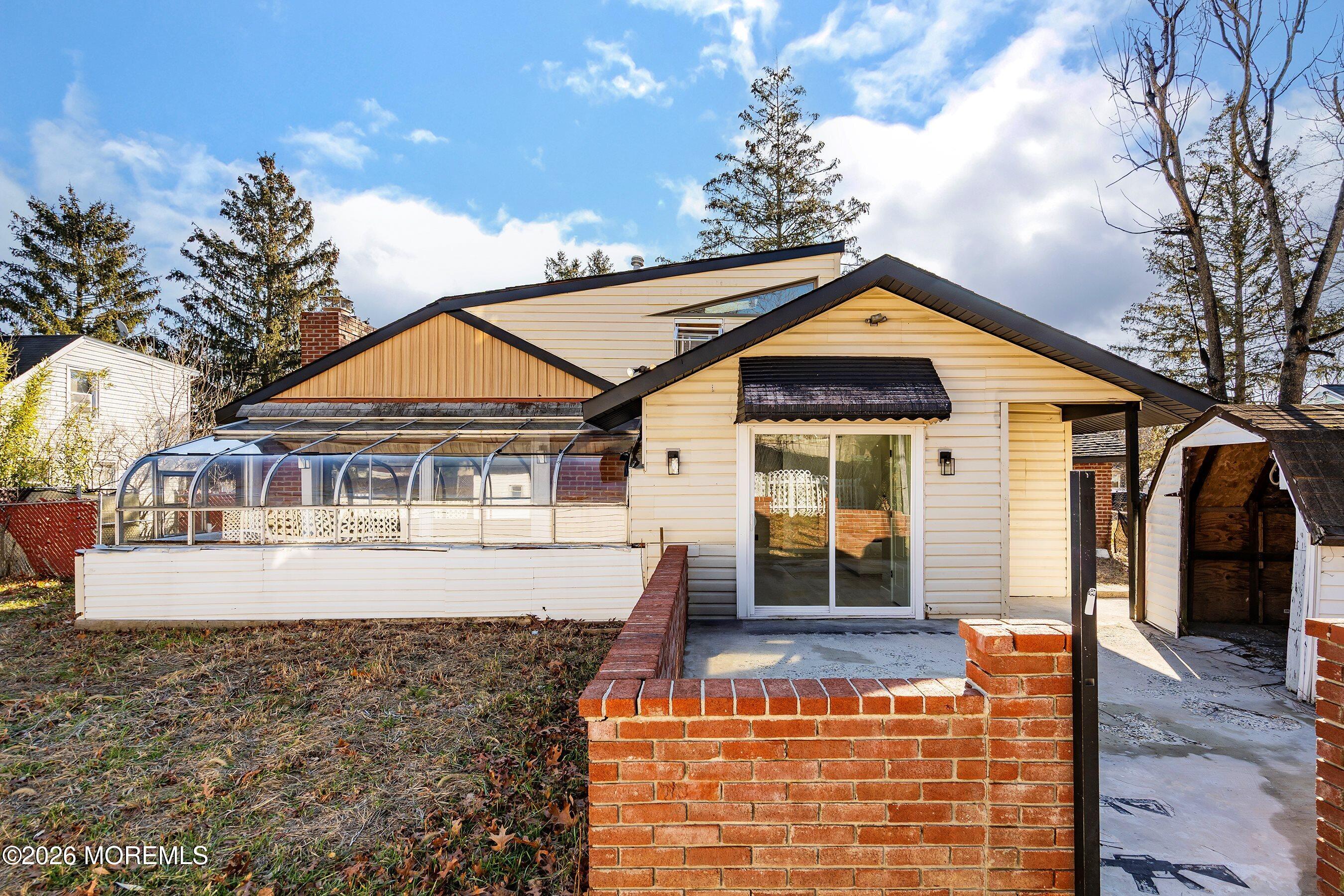 215 Sunset Lane Howell, NJ 07731 - Photo 26 of 27 a front view of a house with garden