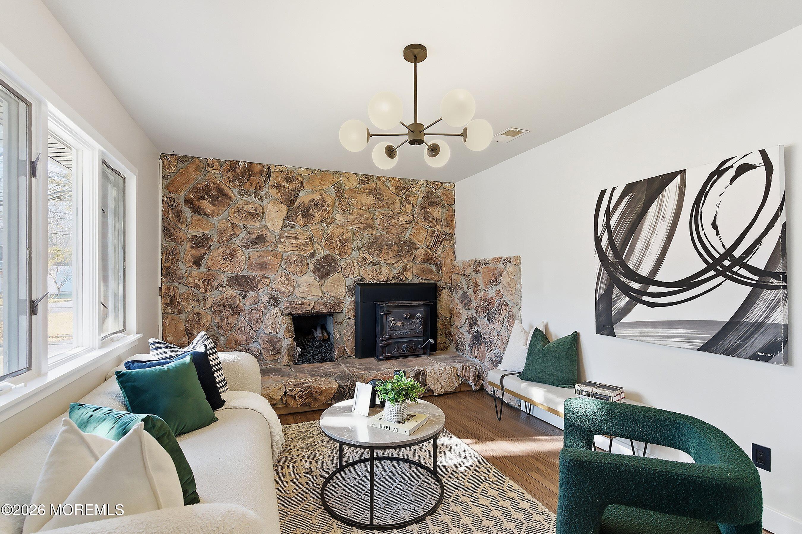 215 Sunset Lane Howell, NJ 07731 - Photo 4 of 27 a living room with furniture and a fireplace