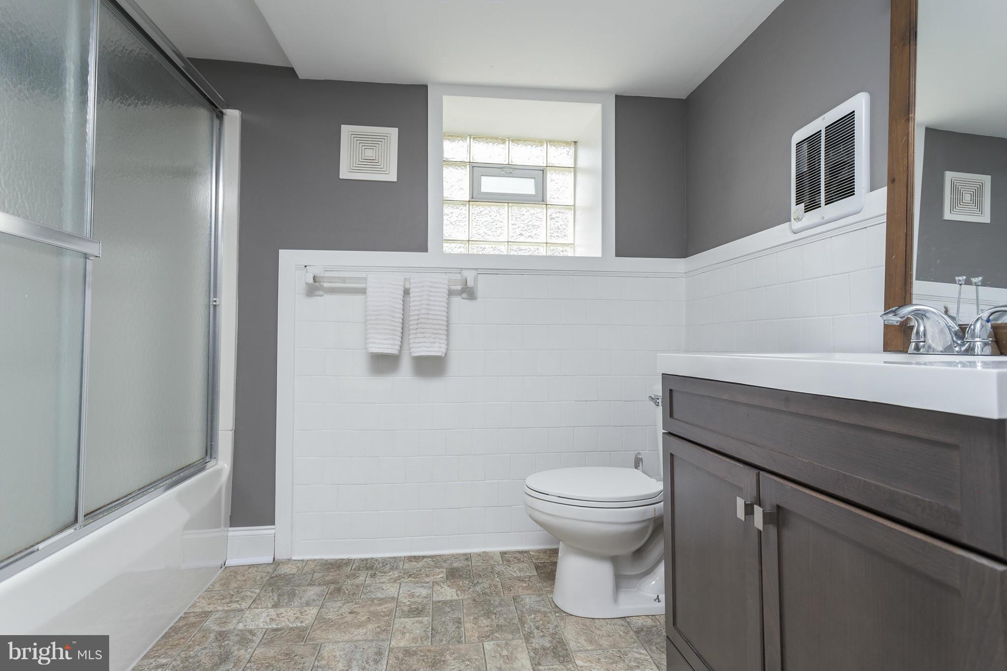403 Overbrook Road Catonsville, MD 21228 - Photo 24 of 30 a bathroom with a sink a toilet a window and vanity
