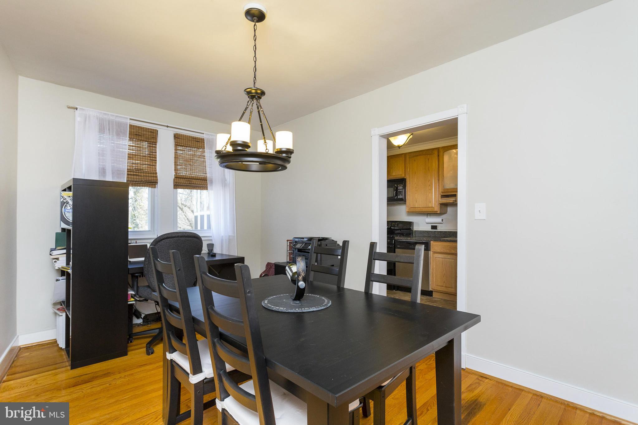 403 Overbrook Road Catonsville, MD 21228 - Photo 8 of 30 a view of a dining room with furniture and wooden floor