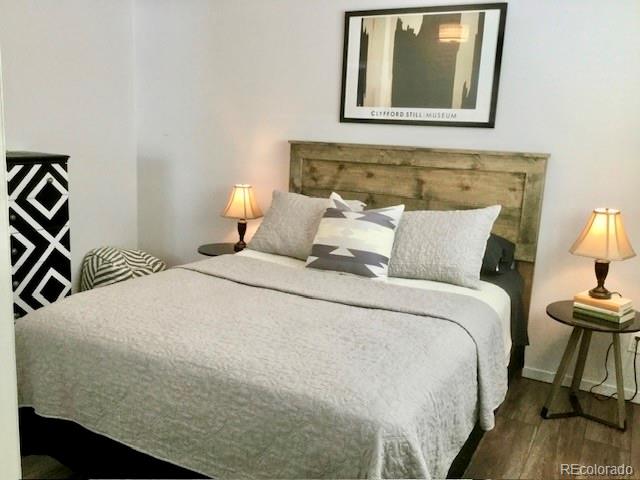 120 Norgren Road, Unit A B C Fraser, CO 80442 - Photo 24 of 39 a bedroom with a bed and a lamp on table