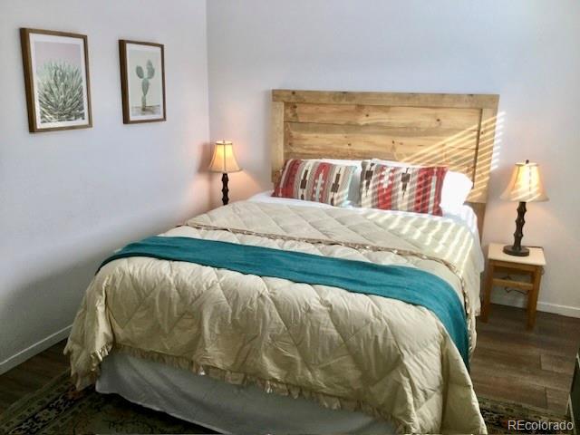 120 Norgren Road, Unit A B C Fraser, CO 80442 - Photo 26 of 39 a bed sitting in a bedroom next to a window