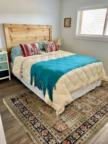 a bathroom with a toilet a sink and a mirror