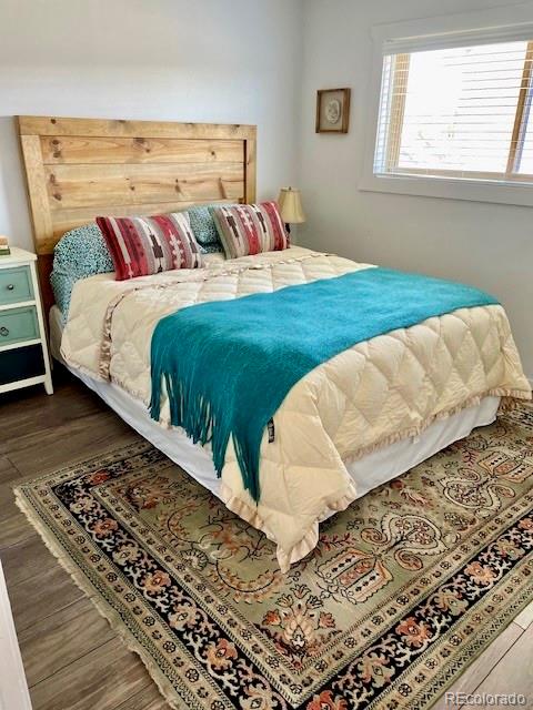 120 Norgren Road, Unit A B C Fraser, CO 80442 - Photo 27 of 39 a bedroom with a bed and a window