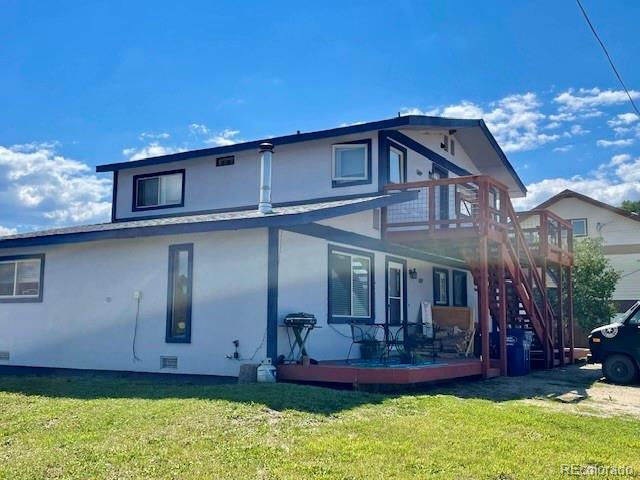 120 Norgren Road, Unit A B C Fraser, CO 80442 - Photo 5 of 39 a front view of a house with a yard
