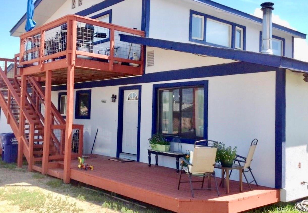 120 Norgren Road, Unit A B C Fraser, CO 80442 - Photo 6 of 39 a view of house with a chairs and table in a patio