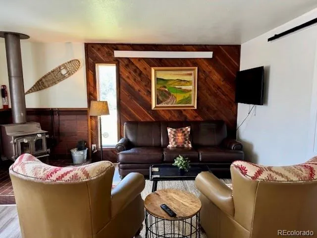 a view of a chairs and table in the backyard