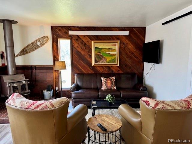 120 Norgren Road, Unit A B C Fraser, CO 80442 - Photo 8 of 39 a living room with furniture and a fireplace