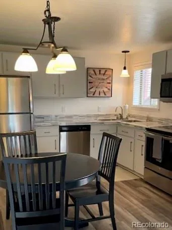 a view of a dining room with furniture and wooden floor