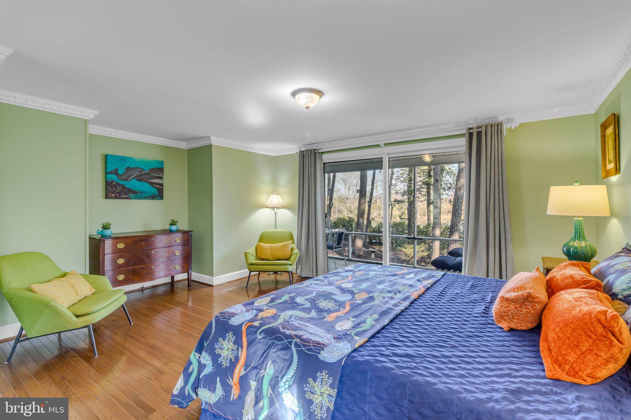 166 Nottingham Drive Reedville, VA 22539 - Photo 11 of 61 a bedroom with a bed and wooden floor