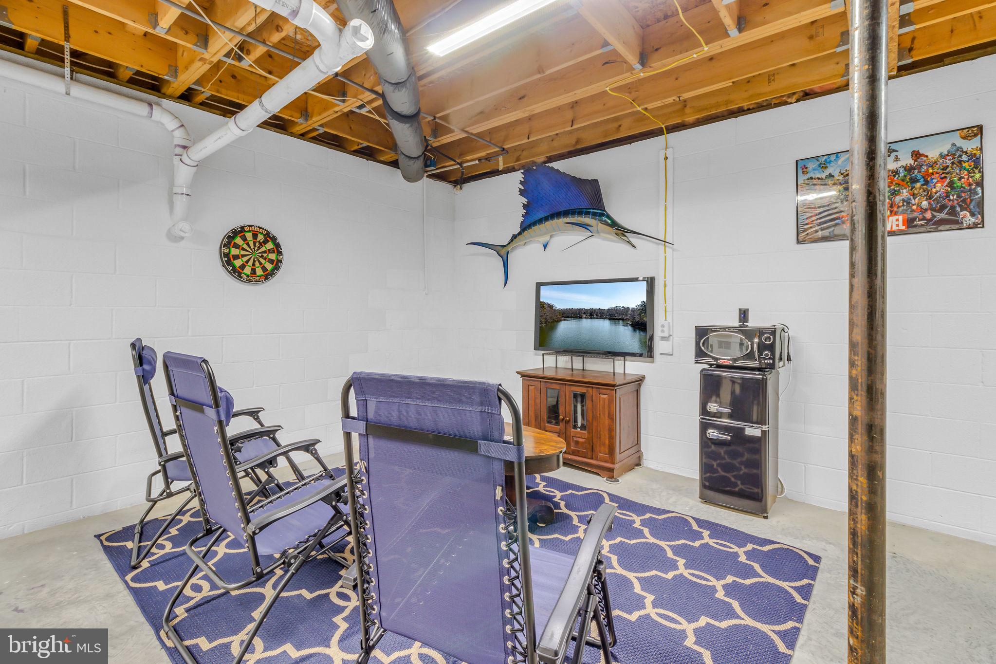 166 Nottingham Drive Reedville, VA 22539 - Photo 13 of 61 a view of a chairs and table in a room