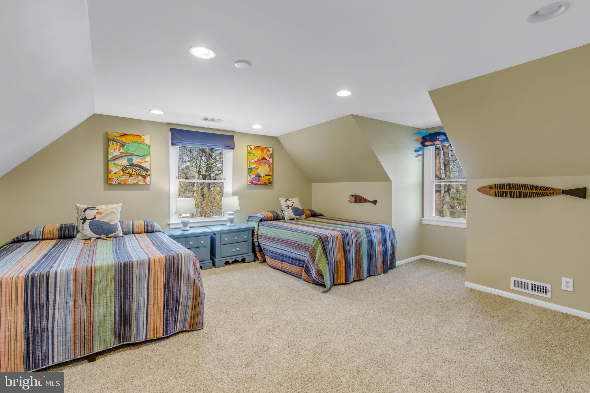 166 Nottingham Drive Reedville, VA 22539 - Photo 15 of 61 a bedroom with two beds and painting on the wall