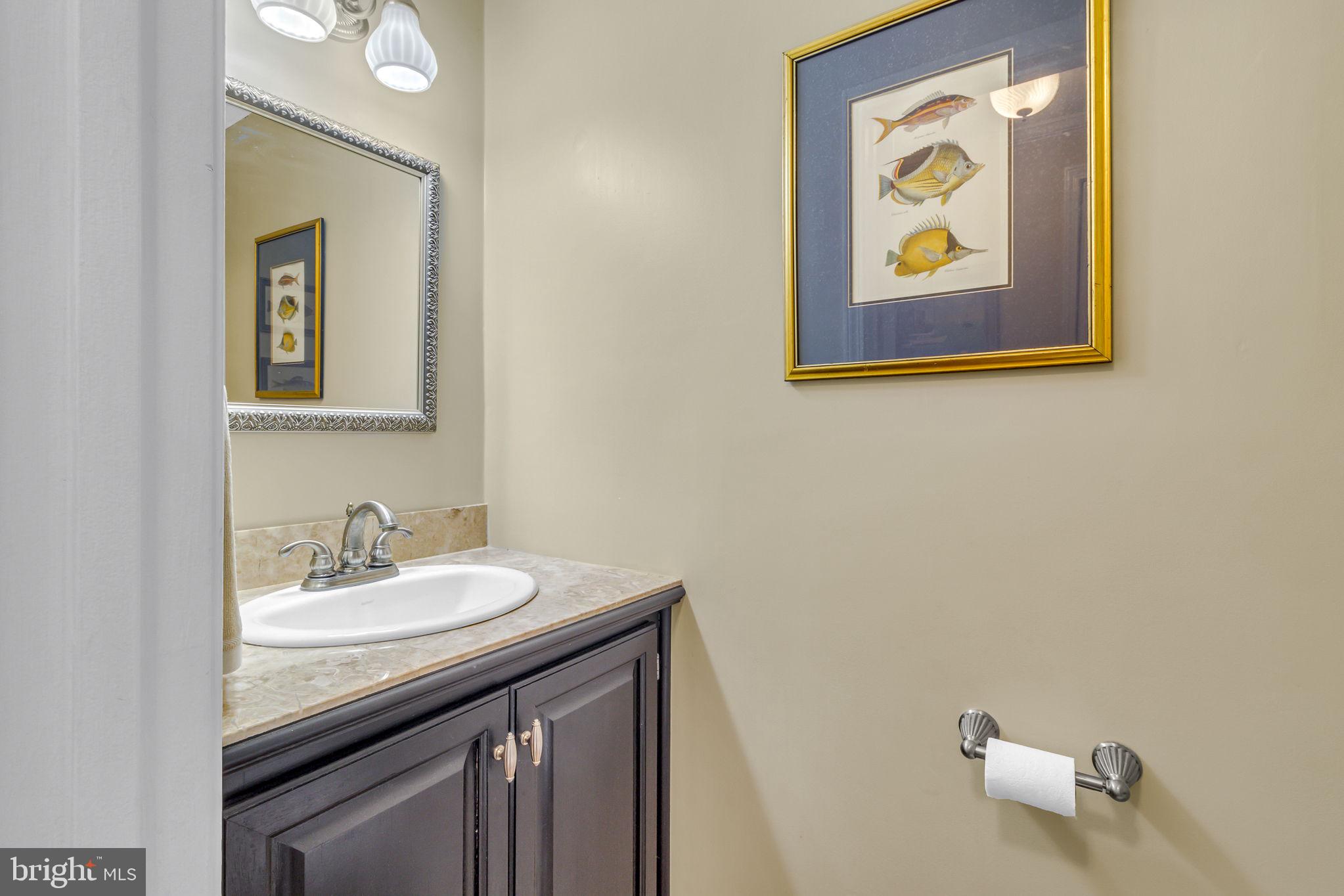 166 Nottingham Drive Reedville, VA 22539 - Photo 22 of 61 a bathroom with a sink mirror and vanity