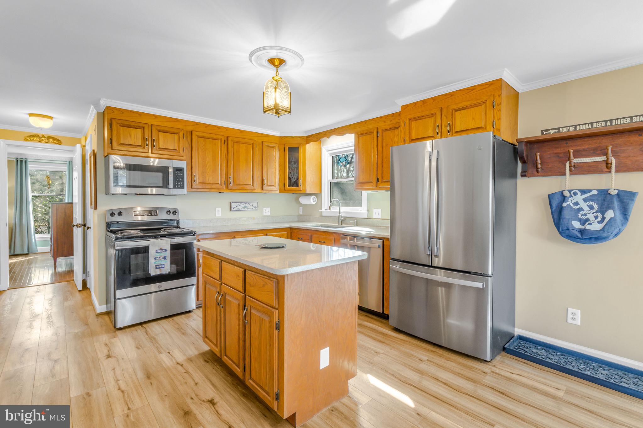 166 Nottingham Drive Reedville, VA 22539 - Photo 8 of 61 a kitchen with a refrigerator and a stove