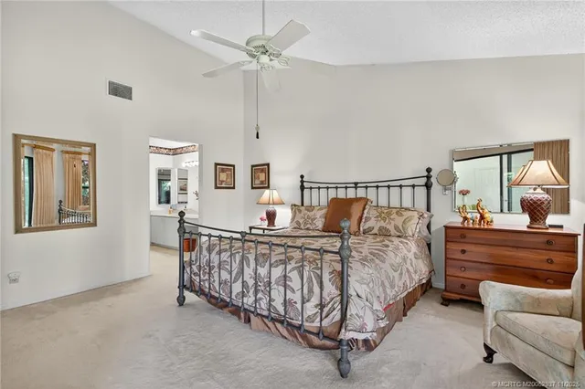 a bed room with a bed and a chandelier