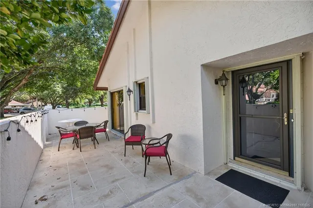 a view of two chairs in the balcony