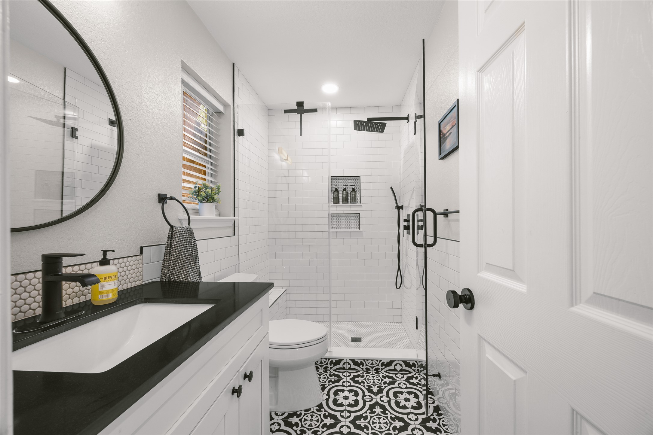 2202 Old Mill Road Cedar Park, TX 78613 - Photo 6 of 23 Bold black and white patterns adorn this beautifully designed bathroom with a spacious walk-in shower.