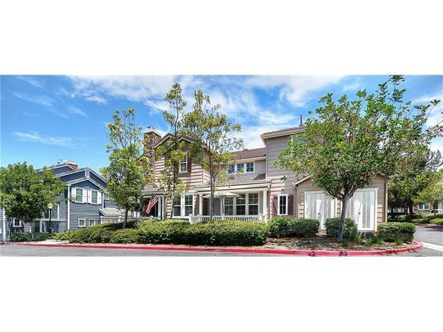55 Ellsworth Street, Unit 27 Ladera Ranch, CA 92694 - Photo 3 of 34 a front view of a house with a yard