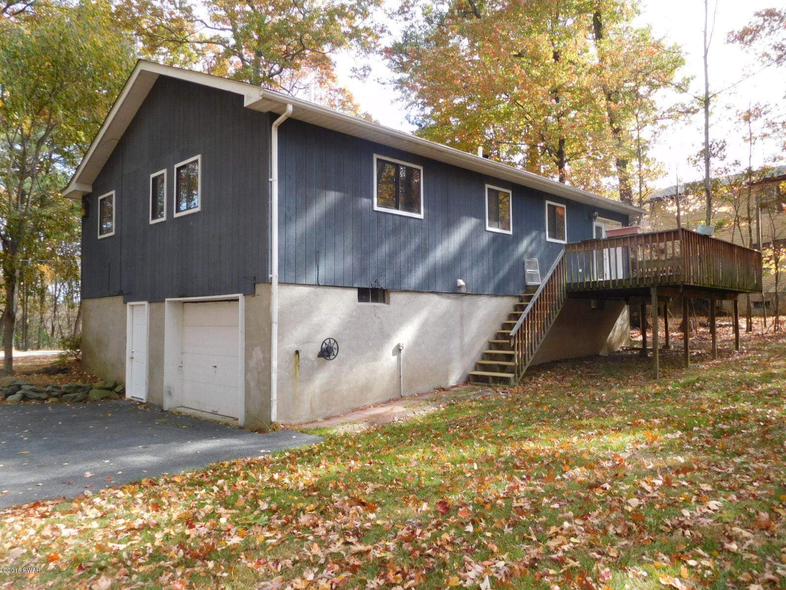 1021 Dancing Ridge Road East Stroudsburg, PA 18302 - Photo 5 of 28 a backyard of a house with table and chairs