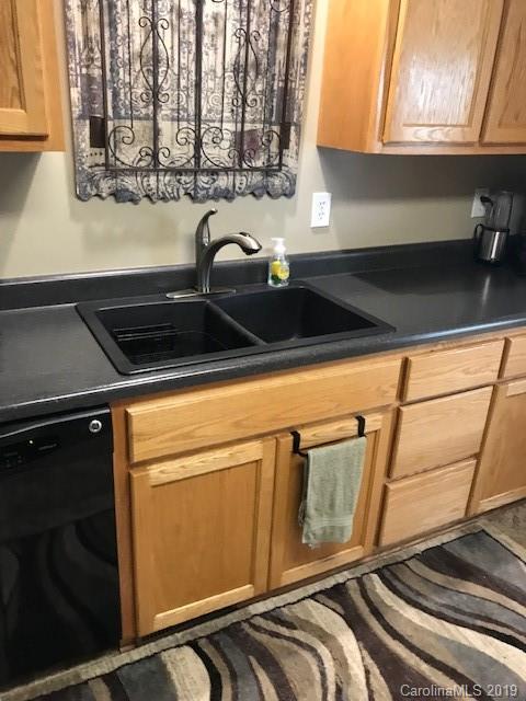 190 Teague Road, Unit 5 Salisbury, NC 28146 - Photo 14 of 26 a close view of a sink a microwave and cabinets in the kitchen