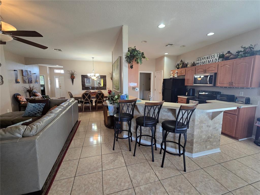 219 Cloverdale Road Winter Haven, FL 33884 - Photo 14 of 29 a large kitchen with a table and chairs