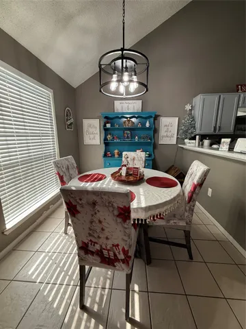 a dining room with furniture window and wooden floor