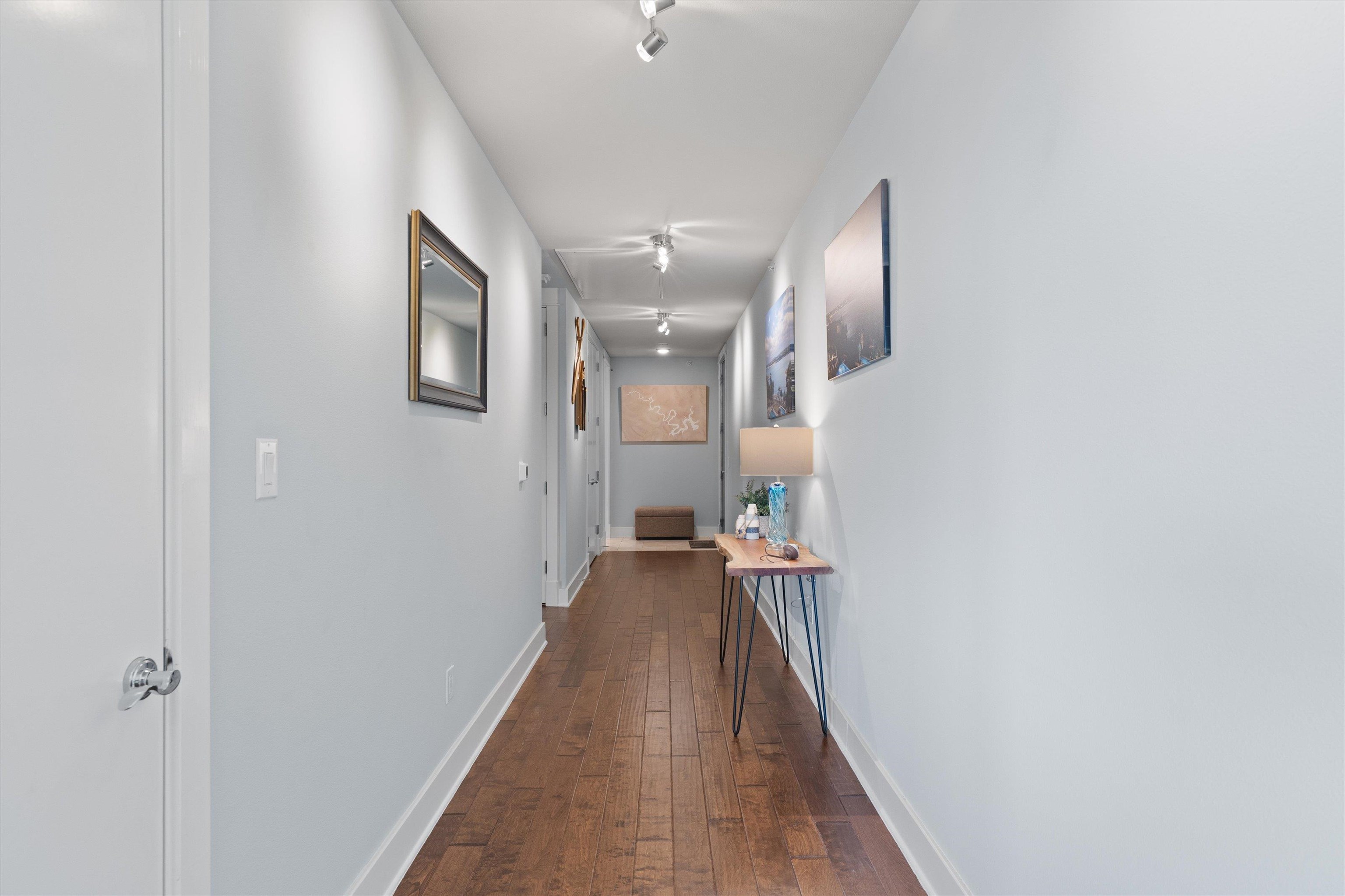 1101 Ivean Pearson Road Lago Vista, TX 78645 - Photo 12 of 30 a view of a hallway with wooden floor and staircase