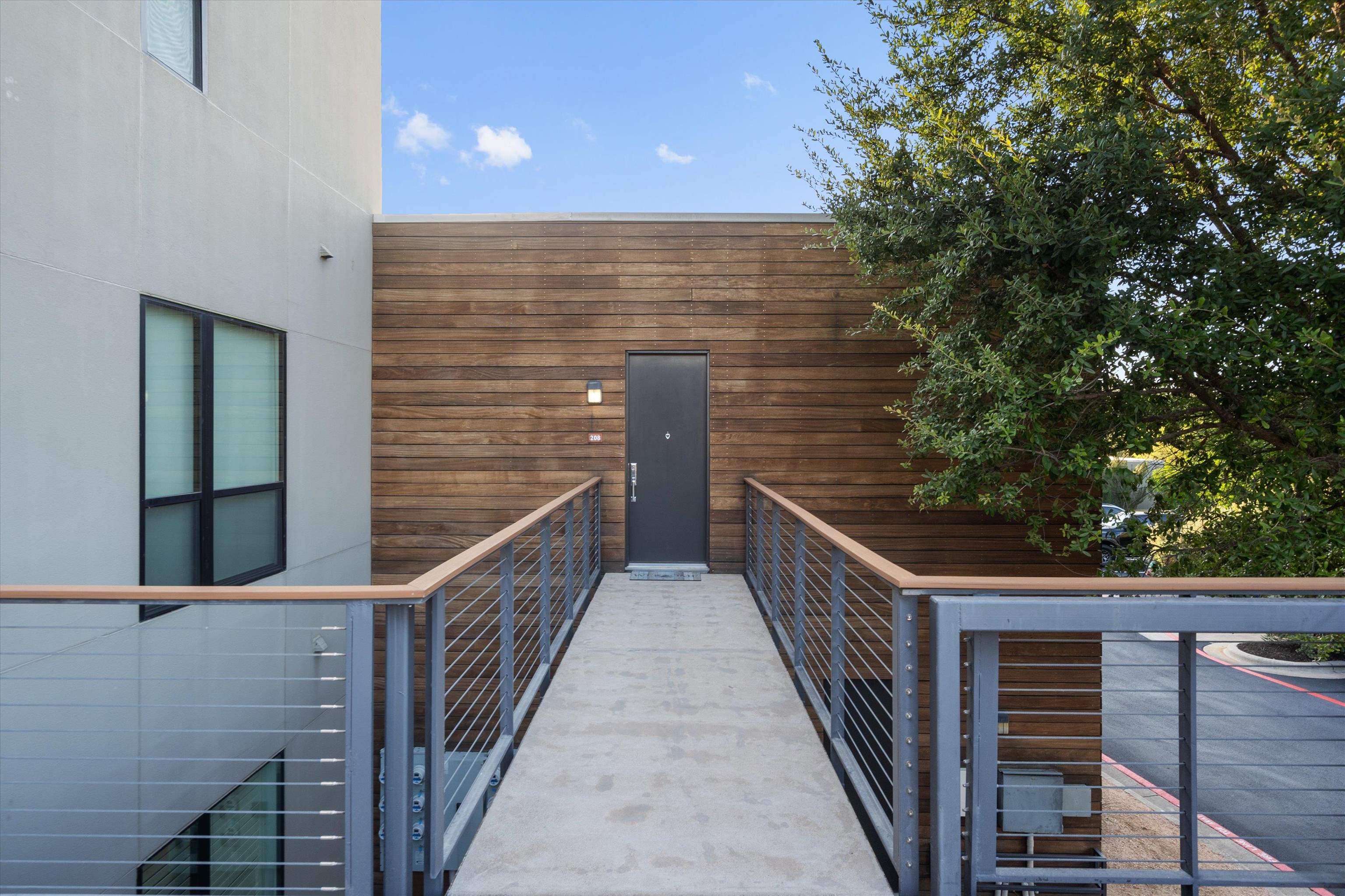 1101 Ivean Pearson Road Lago Vista, TX 78645 - Photo 2 of 30 a view of balcony with wooden floor and fence