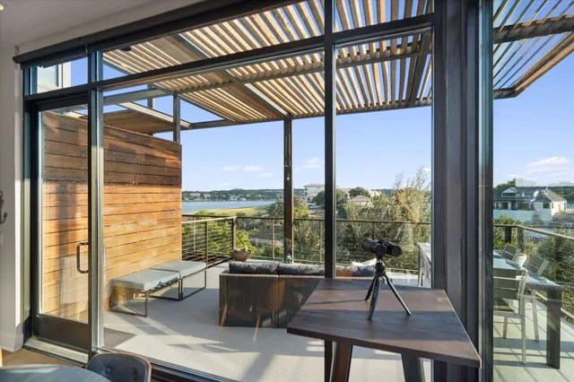 a view of a living room and floor to ceiling window