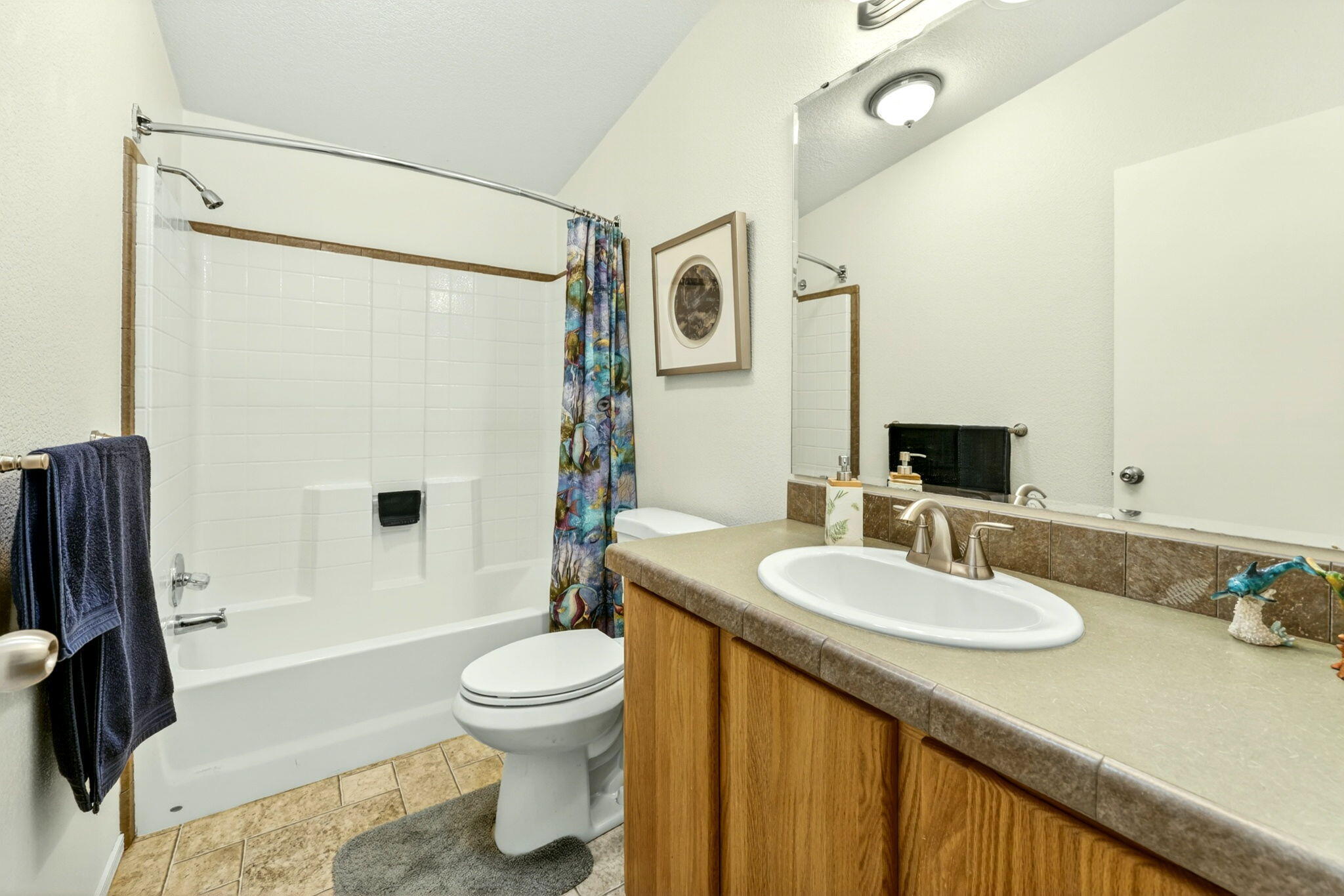 5445 Thompson Creek Road Selma, OR 97538 - Photo 23 of 57 a bathroom with a sink a toilet and a mirror