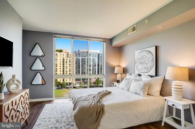 a bed room with a bed and a window