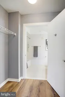 a view of a room with wooden floor