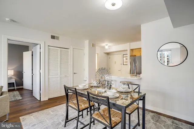 a view of a dining room with furniture and wooden floor