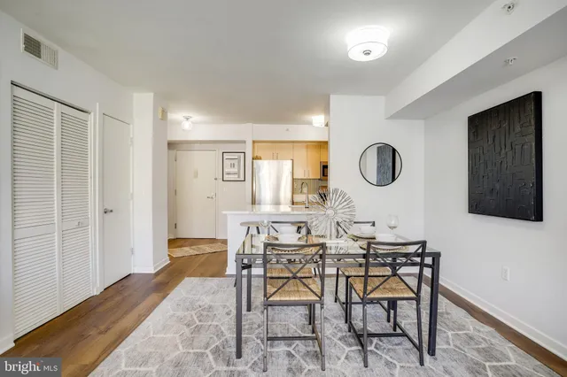 a view of a dining room with furniture and a window