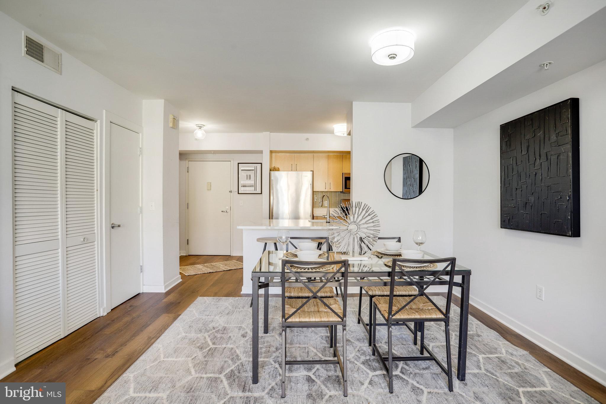 1000 New Jersey Avenue Southeast, Unit 914 Washington, DC 20003 - Photo 29 of 48 a view of a dining room with furniture and a window