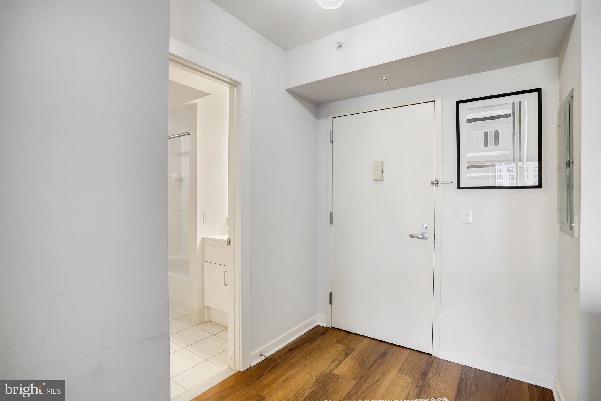 1000 New Jersey Avenue Southeast, Unit 914 Washington, DC 20003 - Photo 30 of 48 a view of a hallway with wooden floor