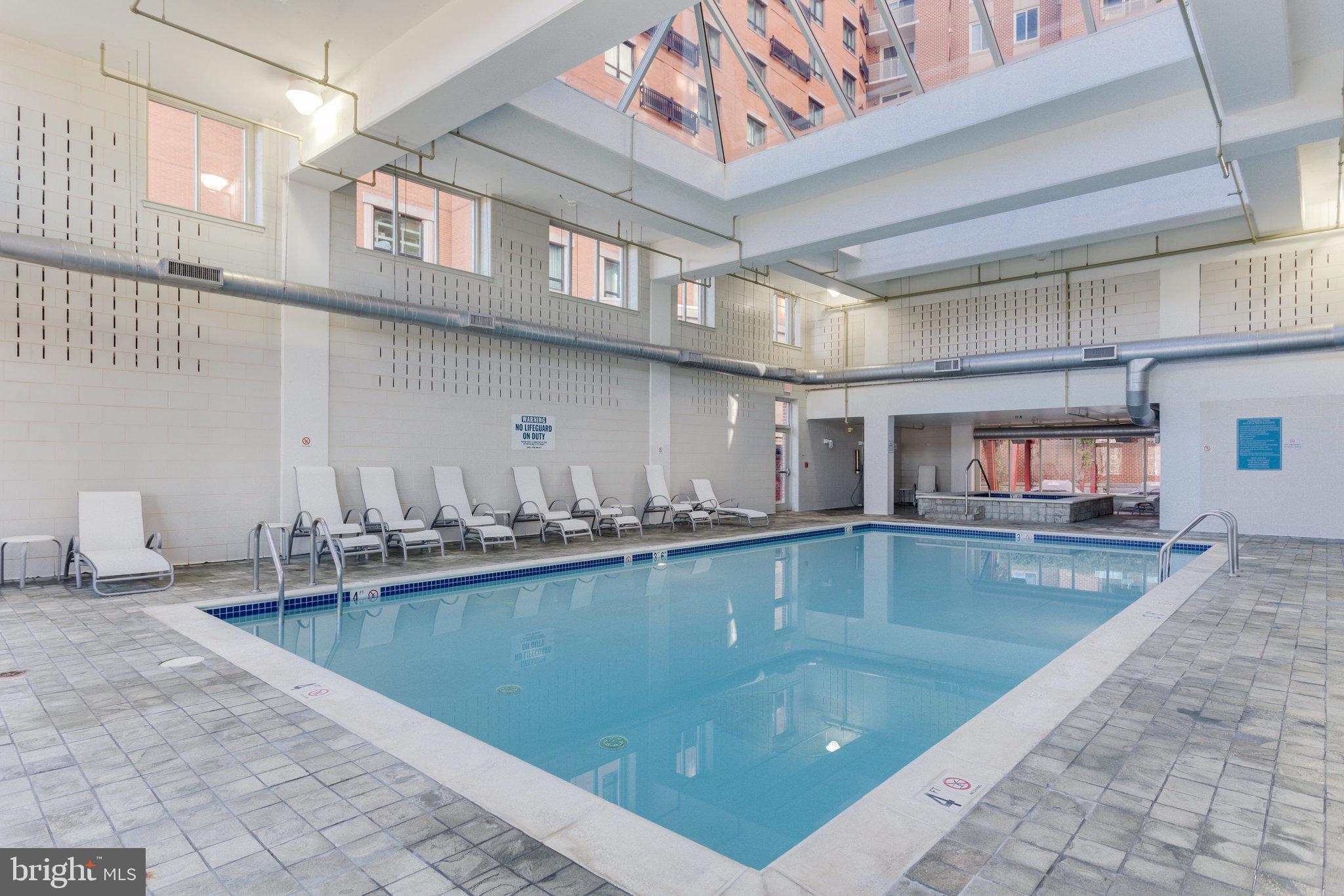 1000 New Jersey Avenue Southeast, Unit 914 Washington, DC 20003 - Photo 32 of 48 a view of a kitchen with kitchen island a sink a counter top space
