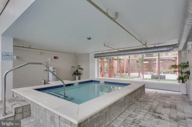 a kitchen with a sink and a large window