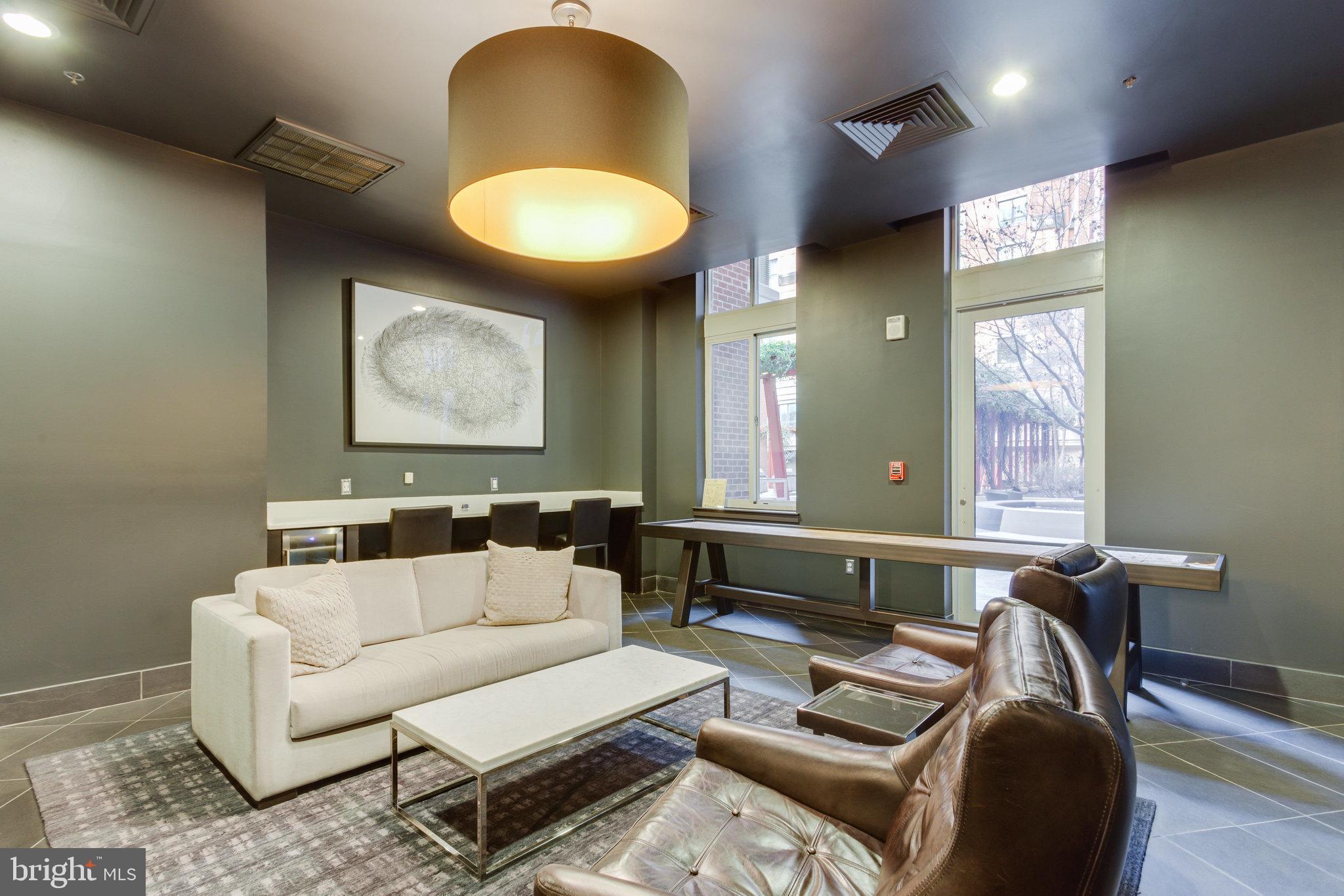 1000 New Jersey Avenue Southeast, Unit 914 Washington, DC 20003 - Photo 42 of 48 a living room with furniture and a large window
