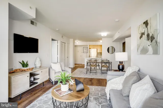 a living room with fireplace furniture and a flat screen tv