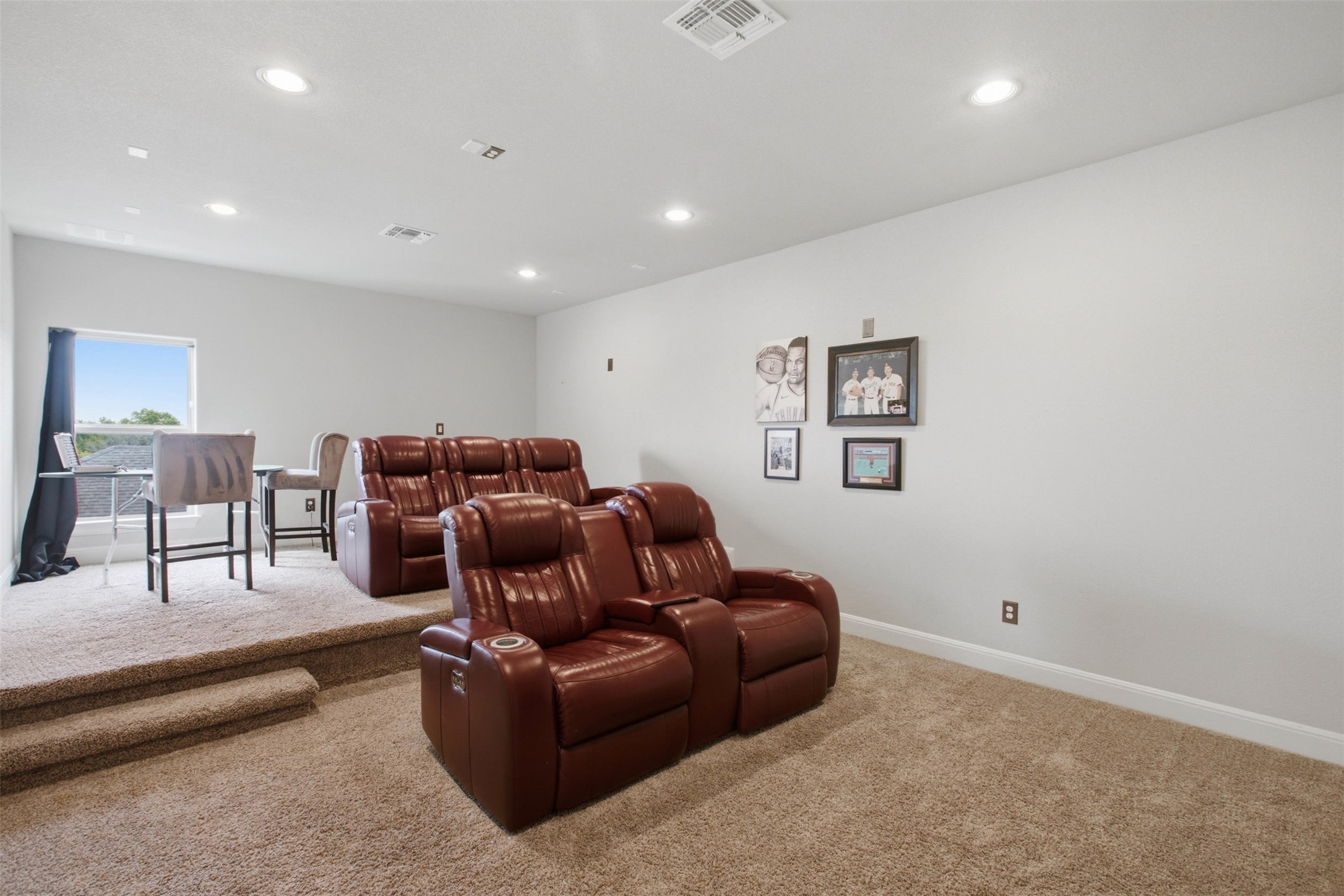 1113 Modoc Way Kyle, TX 78640 - Photo 27 of 34 The home theater offers tiered seating for ultimate viewing comfort with plush, reclining chairs.