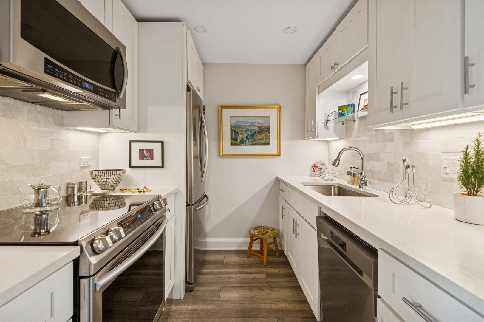 1625 Sheridan Road, Unit 204 Wilmette, IL 60091 - Photo 5 of 16 a kitchen with a sink stove and cabinets