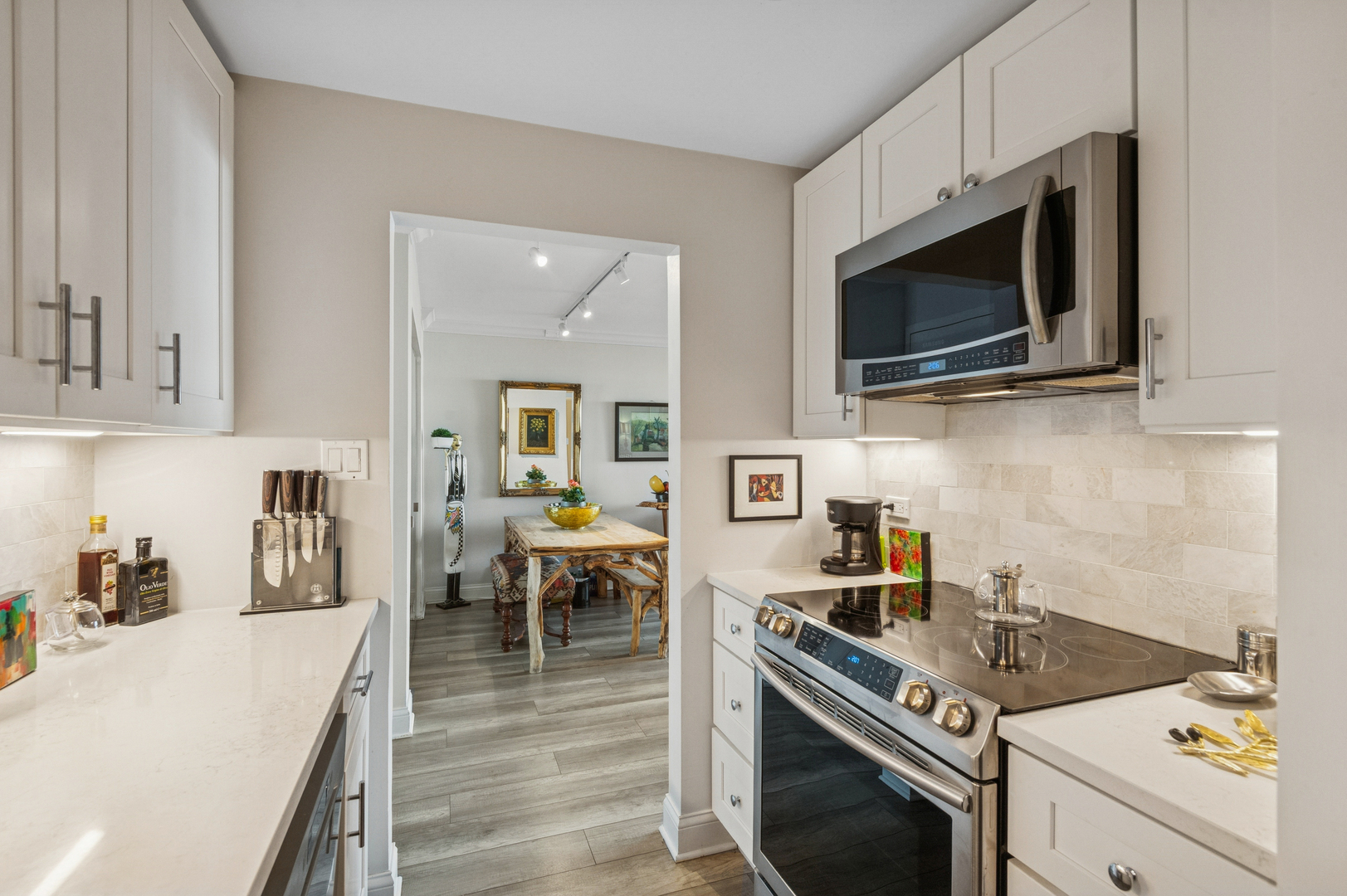 1625 Sheridan Road, Unit 204 Wilmette, IL 60091 - Photo 6 of 16 a kitchen with a stove and a microwave