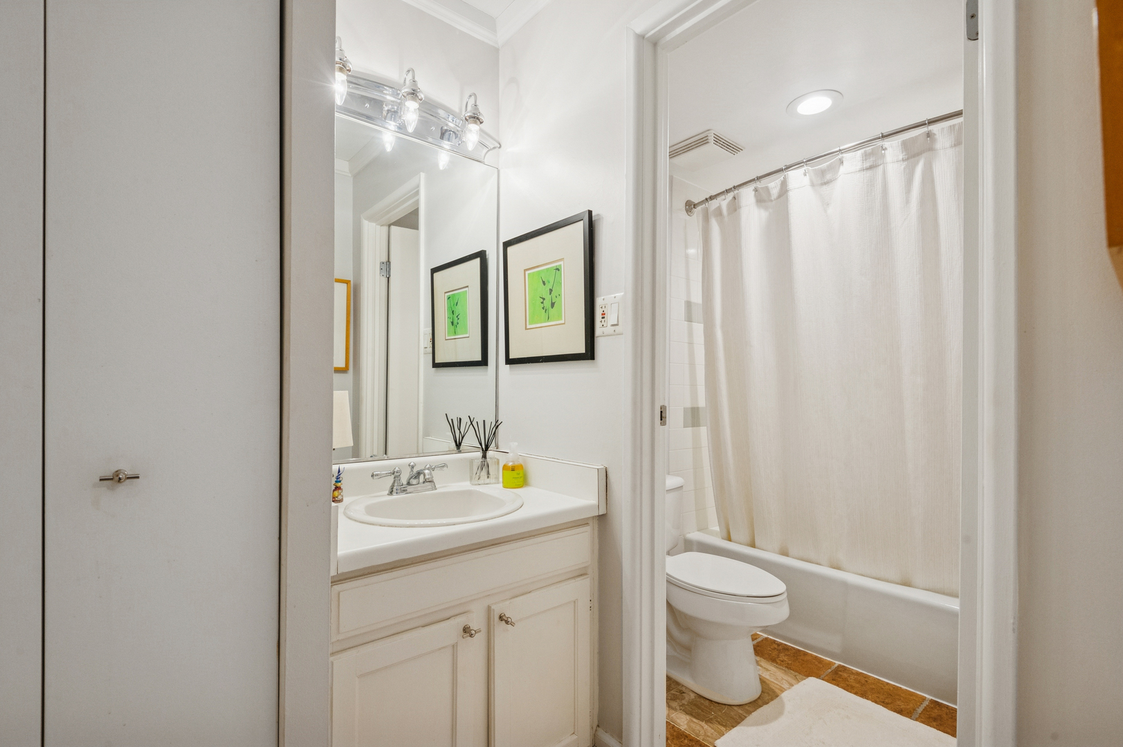 1625 Sheridan Road, Unit 204 Wilmette, IL 60091 - Photo 8 of 16 a bathroom with a sink a toilet and shower curtain