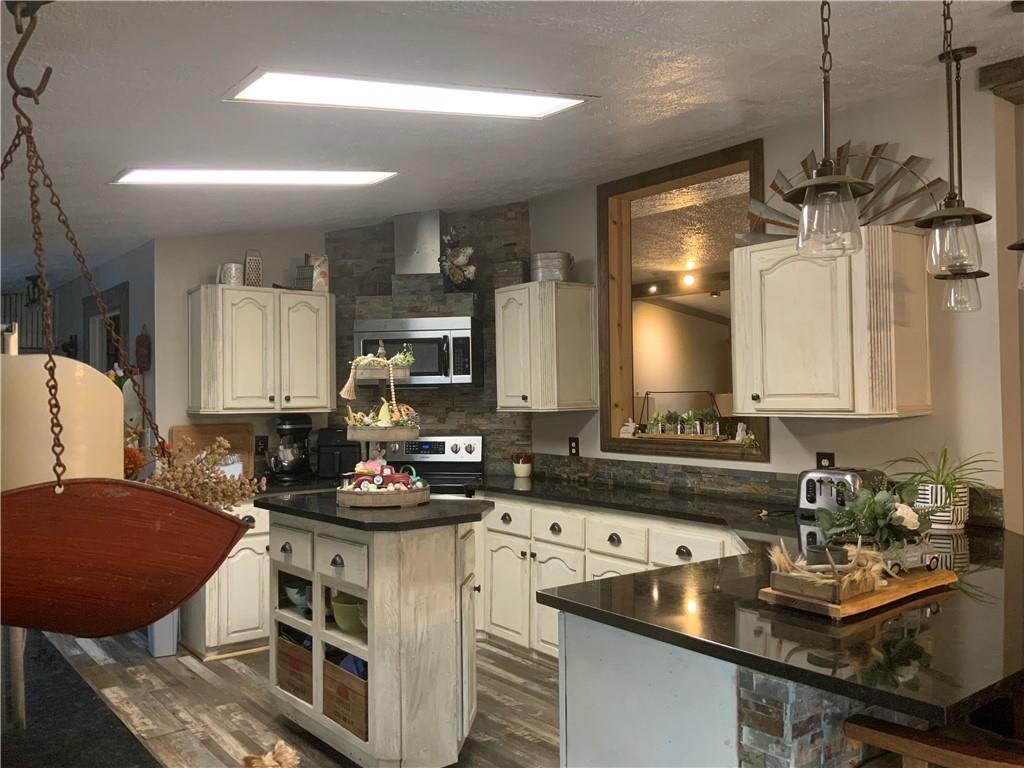 20 Moore Road West Alexander, PA 15376 - Photo 11 of 24 a kitchen with a sink stove and cabinets