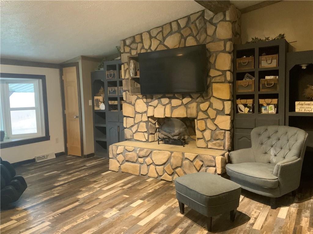 20 Moore Road West Alexander, PA 15376 - Photo 16 of 24 a living room with fireplace furniture and a flat screen tv