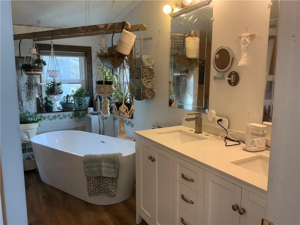 20 Moore Road West Alexander, PA 15376 - Photo 22 of 24 a bathroom with a sink a mirror and a bathtub