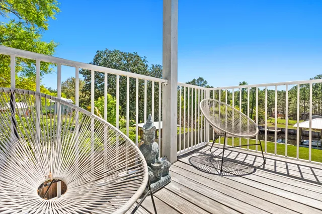 a view of balcony with wooden floor